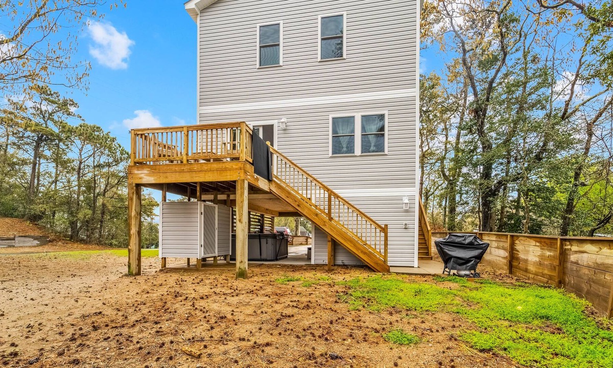 Colington Harbour House | Canal-view, dog-friendly home with private hot tub, deck & grill - near beach