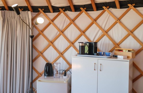 Palm Beach Cabin | Awaawa Yurts - Papa Yurt - Awaawa Yurts offer a luxury glamping experience on Waiheke Island. Stunning views, luxury queen sized bed, private bathroom with tea and coffee making facilities.