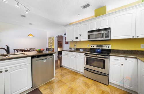 Cocoa Beach House | Beach & Resort Access - Pet Friendly w/Fire Pit, Covered Lanai & BBQ