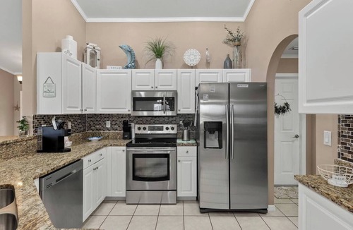 Trafalgar House | Cape Coral Canalfront Oasis: Private Dock, Heated Pool & Arcade Fun