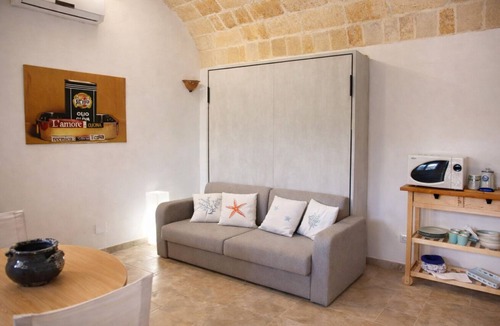 Cenate Apartment | Casina Matilde is a charming retreat carved into an ancient tuff quarry, with walls that tell stories from distant times. This gem, featuring its characteristic barrel vaults, offers a bright furnished veranda for moments of pure stillness, a spacious ro