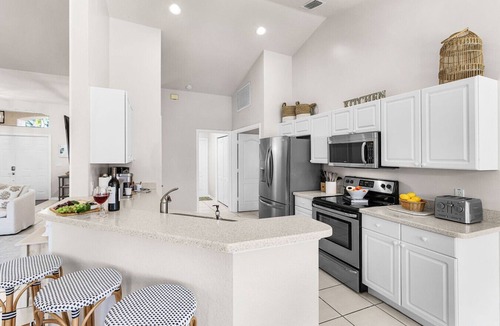 Central Naples House | Lazy days & lake views. Beautiful Naples pool home in Briarwood