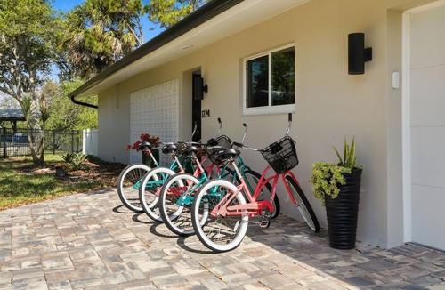 Cocoa Isles House | Luxury Waterfront Retreat Bikes, Hot Tub, Kayak, Walk to downtown Cocoa Beach.