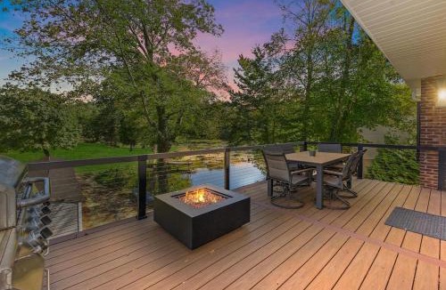 Versailles Villa | Modern Waterfront Retreat with Hot Tub & Pond Views