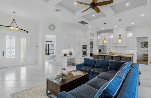 Trafalgar Villa | Relax at Coastal Vibes: Heated Saltwater Pool & Spa Game Room Waterfront View
