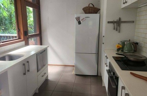 Titirangi Cottage | Romantic Log Cabin Retreat with outdoor bath set amongst the trees