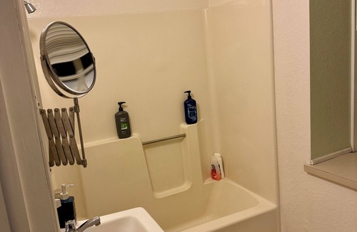 Spillville Apartment | Room 1: Sleep Where Prohibition Secrets Were Made - Historic Escape!