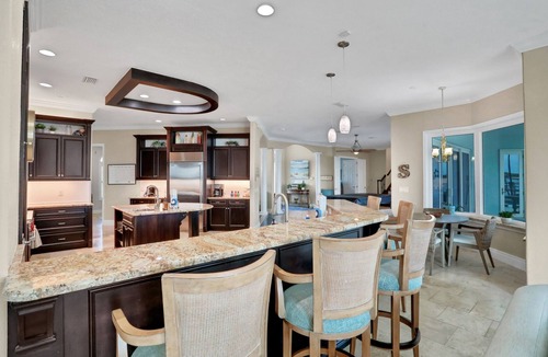 Waterway Park House | Sprawling intercoastal home with boat lifts, pool and hot tub