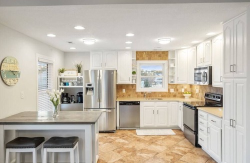 Colington Harbour House | Waterfront! Hot Tub, Game Room, Kayaks, Theater Room,Fire Pit, Comm Pool,Dogs OK