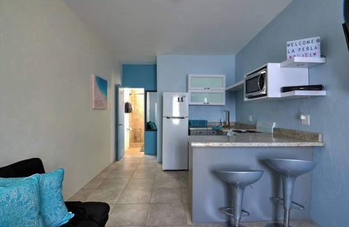 Punta Las Marias Cottage | Welcome to La Perla Roja! Renovated cozy cottage w/shared POOL, laundry & parking in great location, minutes to the SJU & Old San Juan. Walk to Ultimo Trolley beach, Isla Verde beach or Ocean Park beach.