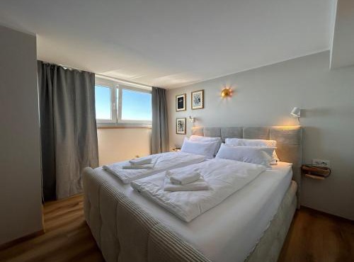 Appartement WOLKE7 byTILLY - Familienfreundliches Alpenzuhause mit Hallenbad, Balkon & Panoramablick hoch oben auf der Gerlitzen