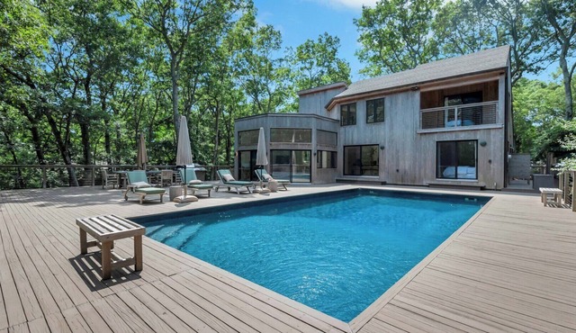 Contemporary and serene estate with heated saltwater pool, expansive.