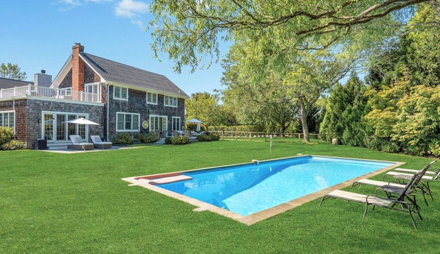 Elegant Water Mill retreat with heated pool, terraces, and timeless.