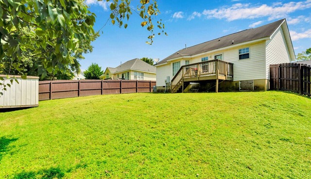 Fenced-Yard 3BR Near CLT & Hospitals | Dog-Friendly + Grill
