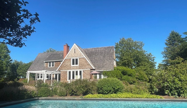 Lushly Landscaped, Light and Spacious Family Home with a 65' Pool