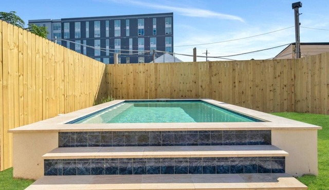Modern 4BR Mid-City home with heated pool & parking. Steps to streetcar, near FQ & parades.