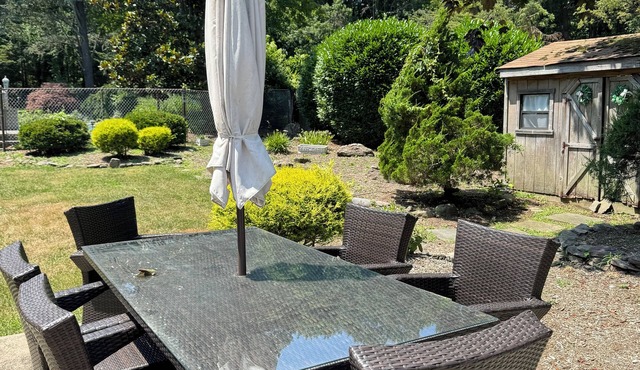 Spacious 6-bedroom house centrally located with pool in charming Dix Hills.