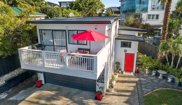 Sunny Coastal Escape with Deck, Privacy & Walk to Long Bay Beach