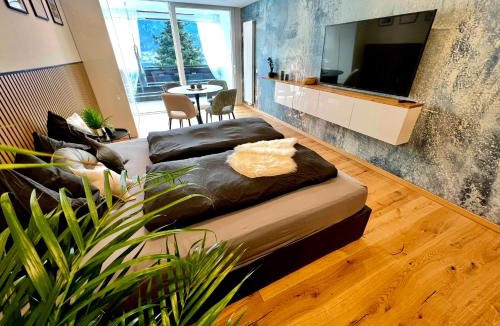Stiegl Apartment | See-Apartment AURA am Fuße der Gerlitzen Alpe und Ufer des Ossiacher Sees - mit privatem Seezugang & Hallenbad